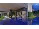 Modern pool with luxurious outdoor seating, landscaping, and views of the house's architectural features at 3530 Cosima Ln, Las Vegas, NV 89120