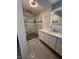 This bathroom features a stunning shower, modern fixtures, and a sleek vanity for a luxurious experience at 3900 San Angelo Ave, Las Vegas, NV 89102