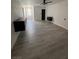 Bright bedroom with floating nightstands, sleek wood flooring, and minimalist decor at 3900 San Angelo Ave, Las Vegas, NV 89102