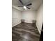 This bedroom features updated flooring, sleek built-in nightstands, and a modern ceiling fan for added comfort at 3900 San Angelo Ave, Las Vegas, NV 89102