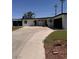 Charming single-story home with a spacious driveway and well-maintained front yard at 3900 San Angelo Ave, Las Vegas, NV 89102