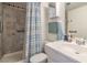 Bathroom with accessible grab bars in shower and beside toilet with stylish tile accents at 3930 University Center Dr # 706, Las Vegas, NV 89119