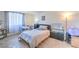 Well-lit bedroom with ample space and storage, featuring hardwood floors and a serene atmosphere at 3930 University Center Dr # 706, Las Vegas, NV 89119
