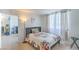 Comfortable bedroom with neutral color palette, soft lighting, and a window view; ideal for relaxation at 3930 University Center Dr # 706, Las Vegas, NV 89119