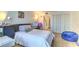 Spacious bedroom with comfortable furnishings, hardwood floors, and ample closet space; perfect for relaxation at 3930 University Center Dr # 706, Las Vegas, NV 89119