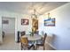 Bright dining area with a modern chandelier, adjacent to the kitchen, ideal for Gathering meals at 3930 University Center Dr # 706, Las Vegas, NV 89119