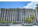 High-rise condominium building with multiple stories, balconies, and parking at 3930 University Center Dr # 706, Las Vegas, NV 89119