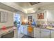 Bright kitchen with white cabinetry, stainless steel sink, and modern appliances at 3930 University Center Dr # 706, Las Vegas, NV 89119