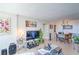 Open-concept living room with tile floors, and a dining area at 3930 University Center Dr # 706, Las Vegas, NV 89119