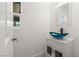 Contemporary half-bathroom showcases a unique glass sink bowl, modern vanity, and window view at 4301 San Joaquin Ave, Las Vegas, NV 89102