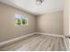 Clean bedroom with neutral tones, modern flooring, and a view to the backyard at 4301 San Joaquin Ave, Las Vegas, NV 89102