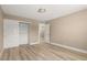 Bedroom featuring wood-look floors, fresh paint, and a spacious closet at 4301 San Joaquin Ave, Las Vegas, NV 89102