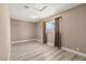Neutral bedroom with laminate flooring, bright light, and a calming color palette at 4301 San Joaquin Ave, Las Vegas, NV 89102