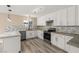 Modern kitchen featuring white cabinets, granite countertops, mosaic backsplash and stainless appliances at 4301 San Joaquin Ave, Las Vegas, NV 89102