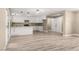 Bright open-concept kitchen and living space with white cabinets and hardwood floors at 4301 San Joaquin Ave, Las Vegas, NV 89102