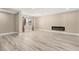 Spacious living room with hardwood floors, modern fireplace, and bright natural light at 4301 San Joaquin Ave, Las Vegas, NV 89102