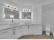 Bathroom features dual sinks with marble countertop, modern fixtures, and toilet at 4604 Barnes Ct, Las Vegas, NV 89147