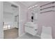 Bathroom featuring modern vanity with basin sink, contemporary lighting, and sleek fixtures at 4604 Barnes Ct, Las Vegas, NV 89147