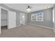 Large bedroom with shuttered windows, carpet, and views of en suite bathroom and closet at 4604 Barnes Ct, Las Vegas, NV 89147