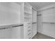 Organized walk-in closet with custom shelving and hanging rods for optimal storage at 4604 Barnes Ct, Las Vegas, NV 89147