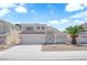 Two-story home featuring desert landscaping, a two-car garage, and a charming entrance at 4604 Barnes Ct, Las Vegas, NV 89147