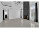 Spacious living room featuring tile floors, fireplace, high ceilings, and lots of natural light at 4604 Barnes Ct, Las Vegas, NV 89147