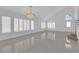 Open concept living room featuring tile flooring and lots of natural light at 4604 Barnes Ct, Las Vegas, NV 89147