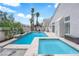 Backyard pool with jacuzzi, deck and palm trees at 4604 Barnes Ct, Las Vegas, NV 89147