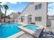 The private backyard features a pool, spa and access to the home's exterior through sliding glass doors at 4604 Barnes Ct, Las Vegas, NV 89147