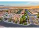 Wide aerial view showing gated community and distant mountains with a glimpse of the city at 4702 Amazing View St, Las Vegas, NV 89129