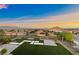 Expansive backyard offering amazing views, a grass lawn, and a patio area at 4702 Amazing View St, Las Vegas, NV 89129