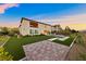 Expansive backyard features a lush lawn, paved patio, and outdoor dining space, perfect for entertaining at 4702 Amazing View St, Las Vegas, NV 89129