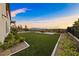 Large grassy backyard provides ample space for recreation, framed by a picturesque mountain view at 4702 Amazing View St, Las Vegas, NV 89129