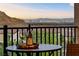 Balcony view featuring a wine bottle and glasses overlooking city and mountain views at 4702 Amazing View St, Las Vegas, NV 89129
