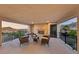 Outdoor balcony with a fireplace and seating area featuring stunning views of the surrounding landscape at 4702 Amazing View St, Las Vegas, NV 89129