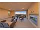 A relaxing outdoor balcony with a fireplace and comfortable seating area showcasing sunset views at 4702 Amazing View St, Las Vegas, NV 89129