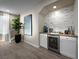 Living area with bar featuring wine fridge and beverage center, with backyard access at 4702 Amazing View St, Las Vegas, NV 89129