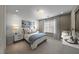 Serene bedroom with neutral colors, soft lighting, and comfortable bedding at 4702 Amazing View St, Las Vegas, NV 89129