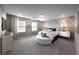 Charming bedroom featuring a unique headboard, neutral tones, and ample natural light at 4702 Amazing View St, Las Vegas, NV 89129