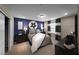 Cozy bedroom with modern decor, a large bed, gray and white curtains, and stylish furnishings at 4702 Amazing View St, Las Vegas, NV 89129