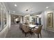 Formal dining room featuring elegant furnishings, neutral tones, and stylish light fixture at 4702 Amazing View St, Las Vegas, NV 89129