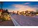 Community entrance featuring professionally landscaped grounds, beautiful entrance and brick-paved roads at 4702 Amazing View St, Las Vegas, NV 89129