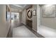 Elegant foyer featuring tile flooring, a decorative mirror, and views into other rooms at 4702 Amazing View St, Las Vegas, NV 89129