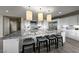 Island kitchen with granite countertops, pendant lights, and stainless steel appliances at 4702 Amazing View St, Las Vegas, NV 89129