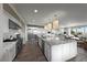 Bright kitchen featuring a central island, stainless steel appliances, and white cabinetry at 4702 Amazing View St, Las Vegas, NV 89129