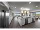 Spacious kitchen with large island, stainless steel appliances, and open layout to living area at 4702 Amazing View St, Las Vegas, NV 89129