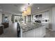 Bright, open kitchen with granite countertops, stainless steel appliances, and island seating at 4702 Amazing View St, Las Vegas, NV 89129