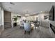 Open living room with fireplace, comfortable seating, and access to the backyard at 4702 Amazing View St, Las Vegas, NV 89129