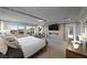 Serene main bedroom featuring a four-poster bed, elegant decor, and scenic views offers a peaceful sanctuary at 4702 Amazing View St, Las Vegas, NV 89129