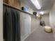 Spacious walk-in closet featuring custom shelving, garment racks and luxury shopping bags at 4702 Amazing View St, Las Vegas, NV 89129